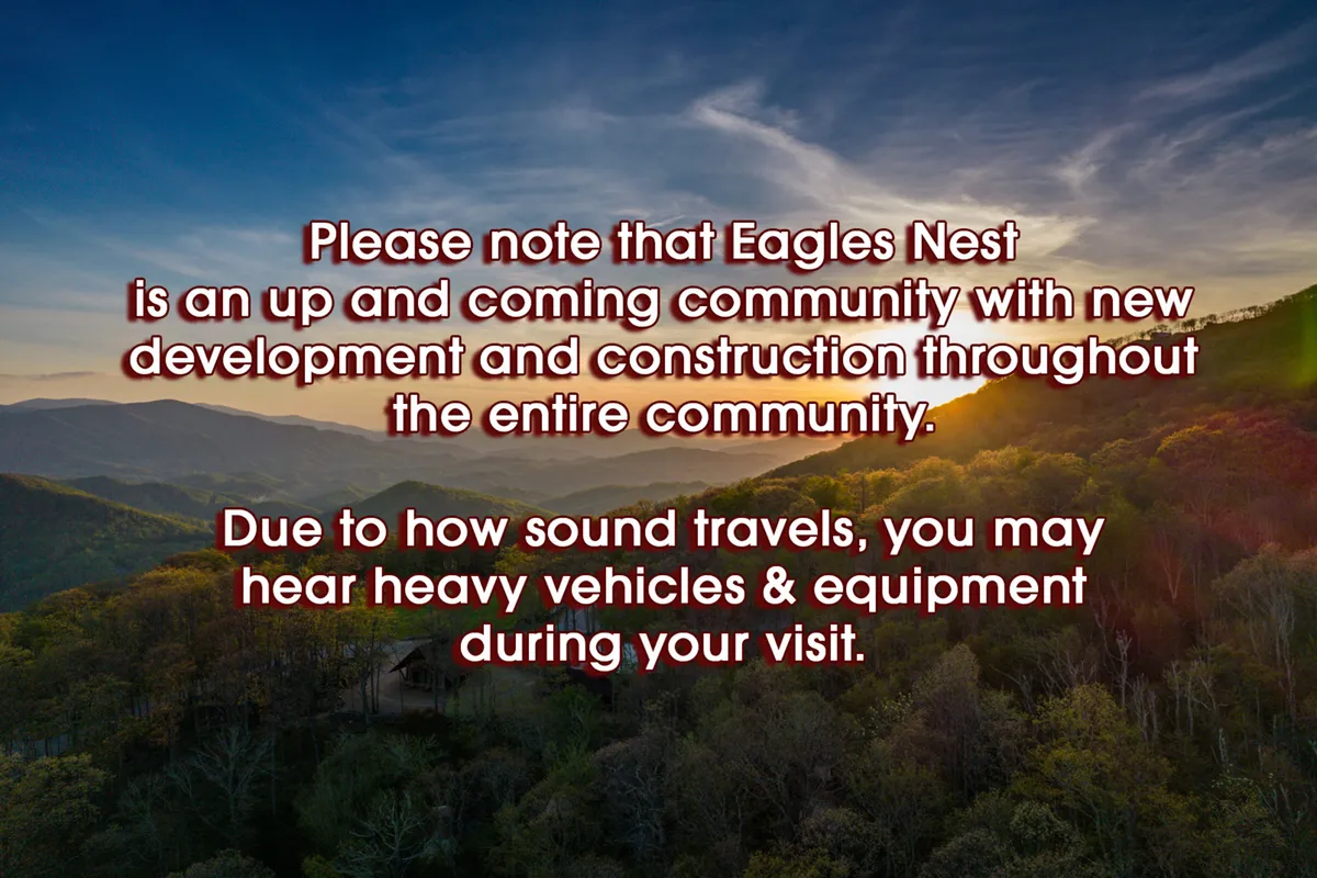 A sweeping view of the Blue Ridge mountain range at sunset, with lush greenery in the foreground. The scene radiates natural beauty and the vastness of the outdoors, capturing the essence of the surrounding wilderness that SkyFall offers.